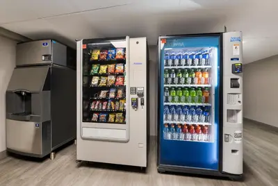 a vending machine filled with lots of sodas and drinks at Essence Express Wayne in Wayne