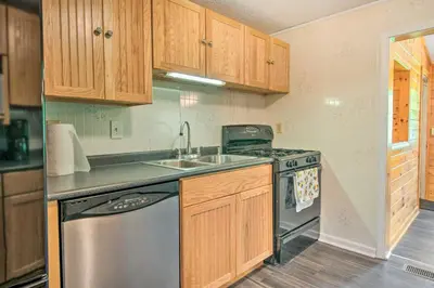 a kitchen with a sink and a dishwasher at River Views and Covered Deck Susquehanna Home! in Susquehanna