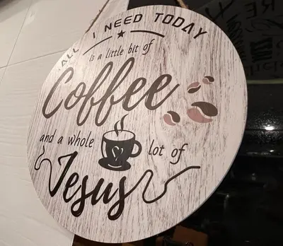 a sign that reads coffee and a whole view not of it at JG Sohotel in New York