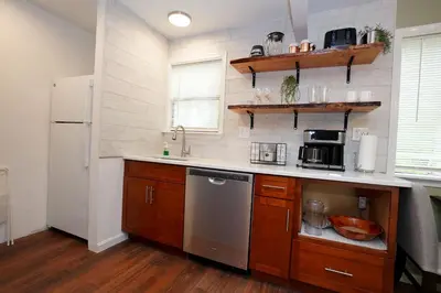 a kitchen with a sink and a refrigerator at ADA-accessible, newly remodeled 3-BR/2-Bath Home in Tobyhanna