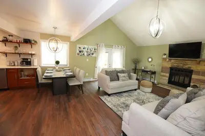 a living room with a couch and a dining room at ADA-accessible, newly remodeled 3-BR/2-Bath Home in Tobyhanna