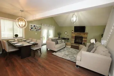 a living room with a table and a dining room at ADA-accessible, newly remodeled 3-BR/2-Bath Home in Tobyhanna