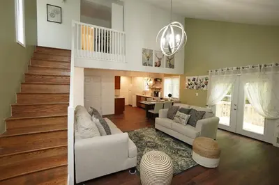 a living room with two couches and a staircase at ADA-accessible, newly remodeled 3-BR/2-Bath Home in Tobyhanna