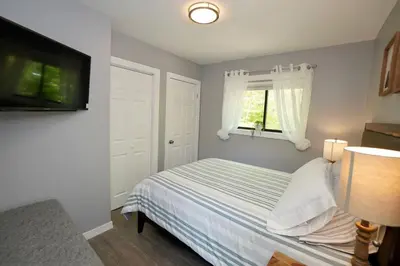 a bedroom with a bed and a window at A gorgeous home, 5BR-2BT, perfect for your family! in Tobyhanna