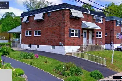 a red brick house with solar panels on it at ABnB Superhost - Siri's Favorite Place in Havertown