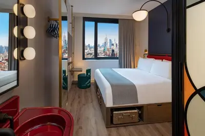 a hotel room with a bed and a window at Moxy NYC Lower East Side in New York