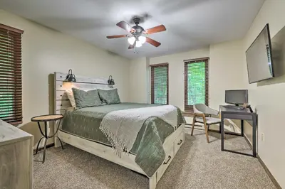 a bedroom with a bed and a ceiling fan at Near Hiking and Skiing Albrightsville Home with Deck! in Albrightsville