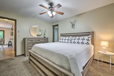 a bedroom with a bed and a ceiling fan at Near Hiking and Skiing Albrightsville Home with Deck! in Albrightsville