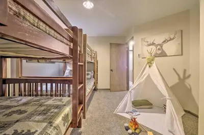 a bedroom with two bunk beds and a play tent at Near Hiking and Skiing Albrightsville Home with Deck! in Albrightsville