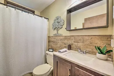 a bathroom with a toilet and a sink and a shower at Near Hiking and Skiing Albrightsville Home with Deck! in Albrightsville