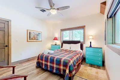 a bedroom with a bed and a ceiling fan at Harmony House in Lake Harmony