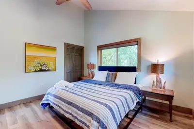 a bedroom with a bed and a window at Harmony House in Lake Harmony