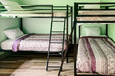 two bunk beds in a room with a bed at Harmony House in Lake Harmony