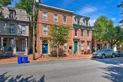 a street in an old town with brick buildings at 1 Mi to Dtwn Historic Harrisburg Home in Harrisburg