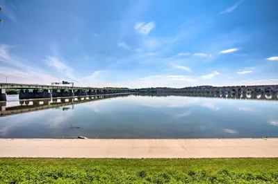 a large body of water with a bridge in the background at 1 Mi to Dtwn Historic Harrisburg Home in Harrisburg