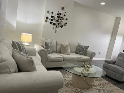 a living room with a couch and a table at Cozy Home located in a prime area. in Philadelphia