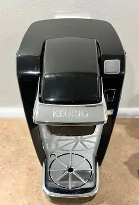 a black and silver toaster sitting on a counter at Cozy Home located in a prime area. in Philadelphia