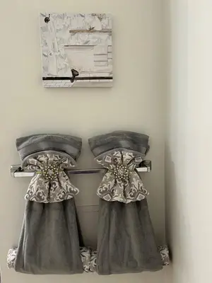 two dresses hanging on a wall in a room at Cozy Home located in a prime area. in Philadelphia