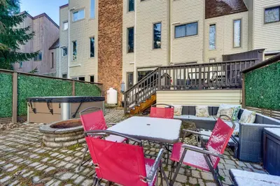 a patio with red chairs and a table and a grill at Mtn-View Gem with Deck and Hot Tub in Tannersville in Tannersville