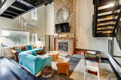 a living room with a couch and a fireplace at Mtn-View Gem with Deck and Hot Tub in Tannersville in Tannersville