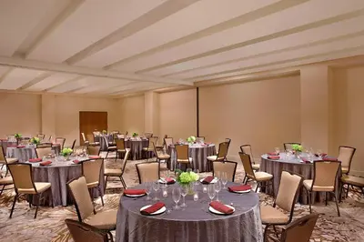 a ballroom with tables and chairs and a room filled with at The Westin Wilmington in Wilmington