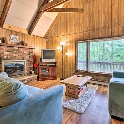 Game Room and Fire Pit Tree-Lined Pocono Lake Cabin