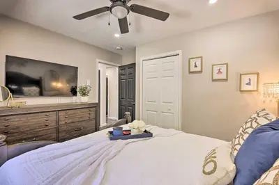 a bedroom with a bed and a ceiling fan at Fire Pit and Furnished Deck Serene Tobyhanna Escape in Tobyhanna