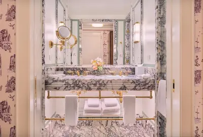a bathroom with a sink and a mirror at Fouquet's New York in New York