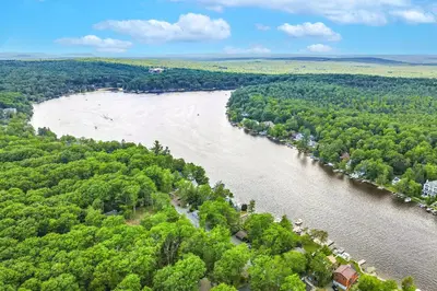 an aerial view of a river with trees at Harmony Haven in Lake Harmony