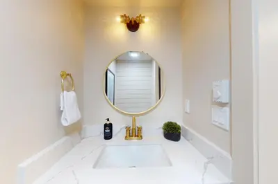 a bathroom with a sink and a mirror at Harmony Haven in Lake Harmony