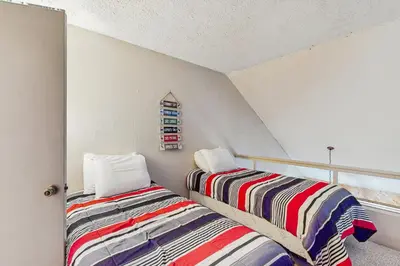 two beds sitting next to each other in a room at Jumpin' Jack Frost in Lake Harmony