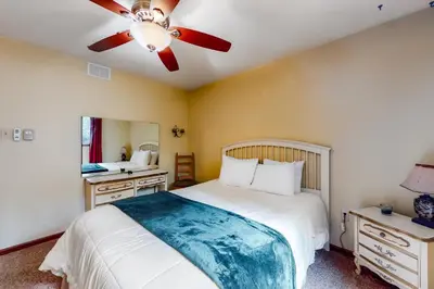 a bedroom with a bed and a ceiling fan at The Burrow in Jim Thorpe