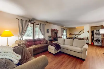 a living room with a couch and chairs and a table at The Burrow in Jim Thorpe