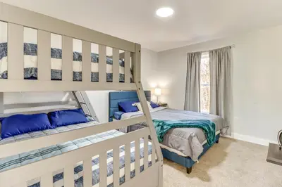 a bedroom with two bunk beds and a window at Hot Tub! Family Tobyhanna Getaway 12 Mi to Slopes in Tobyhanna
