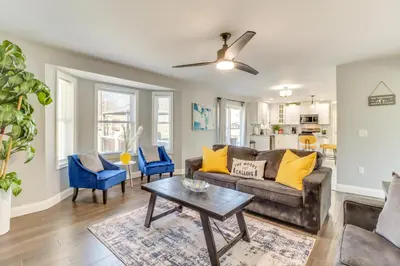 a living room with a couch and a table at Hot Tub! Family Tobyhanna Getaway 12 Mi to Slopes in Tobyhanna