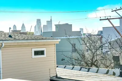a view of the city from the roof of a house at Spacious Oasis - Parking, Private Patio & Roofdeck in Philadelphia