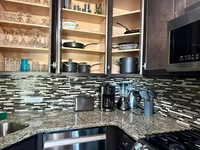 a kitchen with a counter top with pots and pans at Peaceful Pocono Lakefront, beach, pools, firepit, pets in Arrowhead Lake