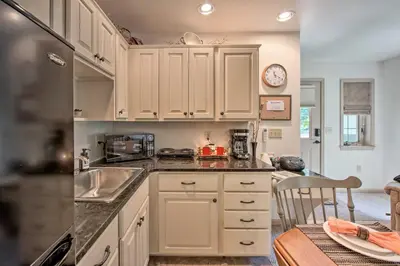 a kitchen with white cabinets and a sink at Cozy Garden Room in Welsh Mountain Suites! in New Holland