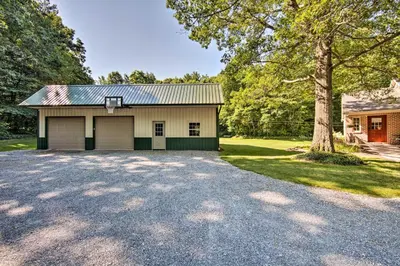 a garage with a basketball hoop on top of it at Cozy Garden Room in Welsh Mountain Suites! in New Holland