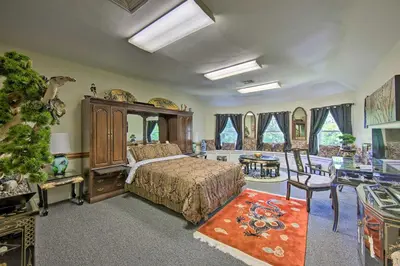 a bedroom with a bed and a christmas tree at 8 Mi to Hersheypark Millard Mansion in Annville in Annville