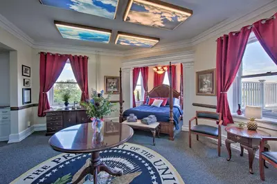 a bedroom with a bed and a table at 8 Mi to Hersheypark Millard Mansion in Annville in Annville