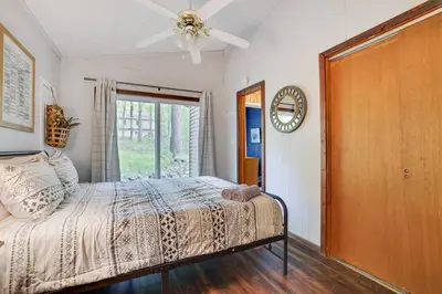 a bedroom with a bed and a ceiling fan at Pet Friendly Ski Retreat in Lake Community in Locust Lakes Village