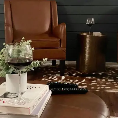 a glass of wine sitting on top of a table at Pet Friendly Ski Retreat in Lake Community in Locust Lakes Village