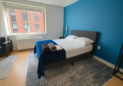 a bedroom with a bed with two towels on it at Studio apart Time Square in New York