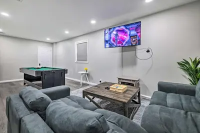 a living room with couches and a pool table at Furnished Deck and Lake Access Poconos Place! in Tobyhanna