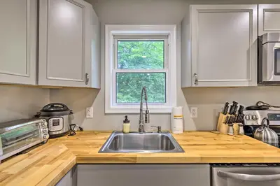 a kitchen with a sink and a window at Furnished Deck and Lake Access Poconos Place! in Tobyhanna