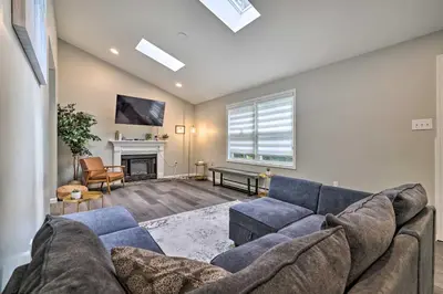 a living room with a couch and a fireplace at Furnished Deck and Lake Access Poconos Place! in Tobyhanna