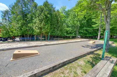 a skateboard park with two ramps on the ground at Golf, Ski and Fish Cabin with Deck in Tobyhanna! in Tobyhanna
