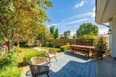 a backyard with a picnic table and chairs at The Walton House - historic 3bd 2 5ba with parking in Kennett Square