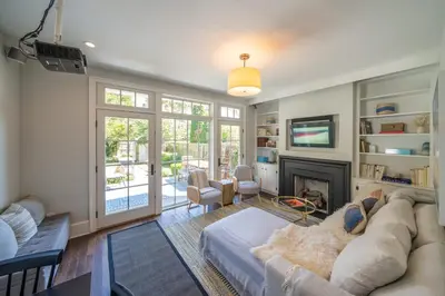 a living room with a couch and a fireplace at The Walton House - historic 3bd 2 5ba with parking in Kennett Square
